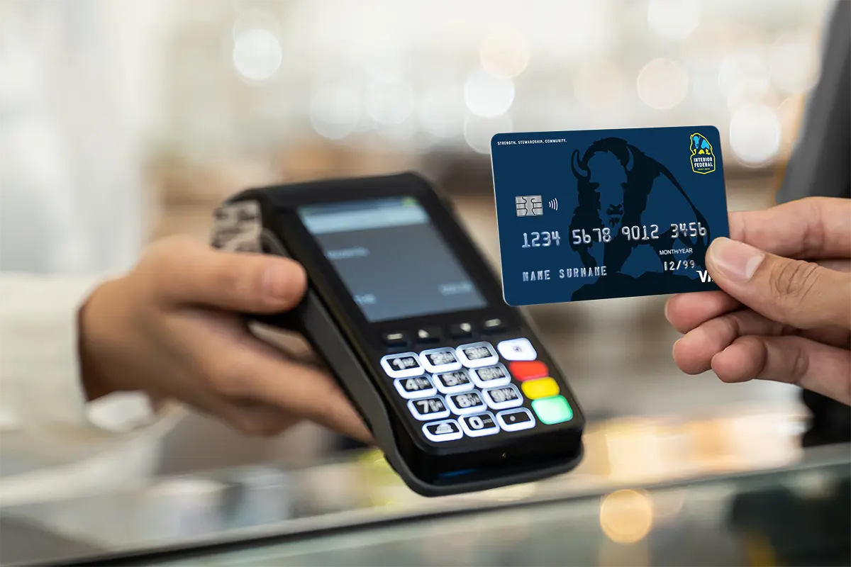 someone using an Interior Federal credit card at a merchant