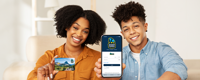 two teens with mobile app and debit card