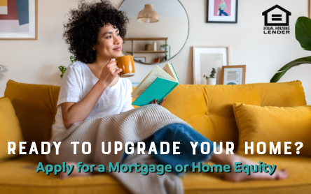 girl sitting on couch sipping coffee and reading a book